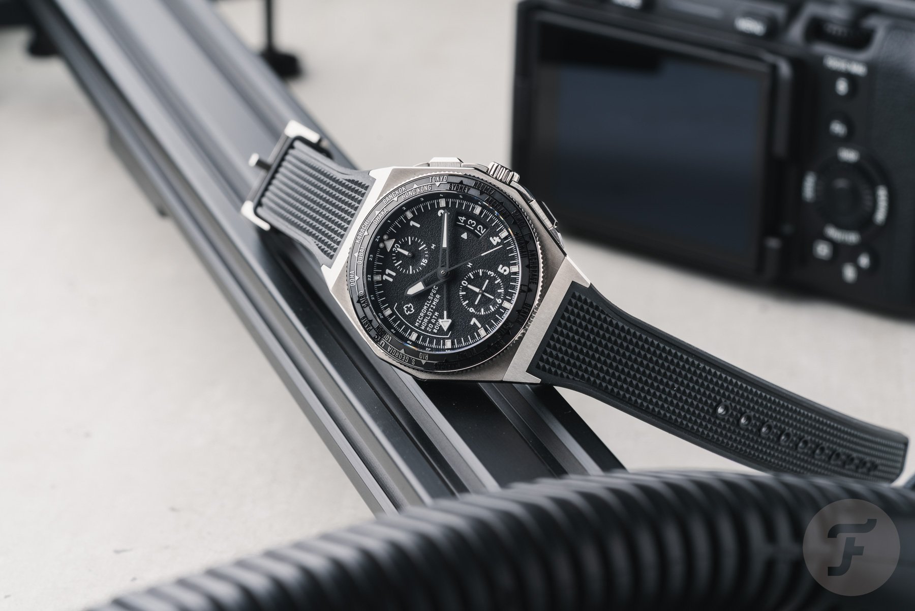 Micromilspec Worldtimer Black on side, crown up